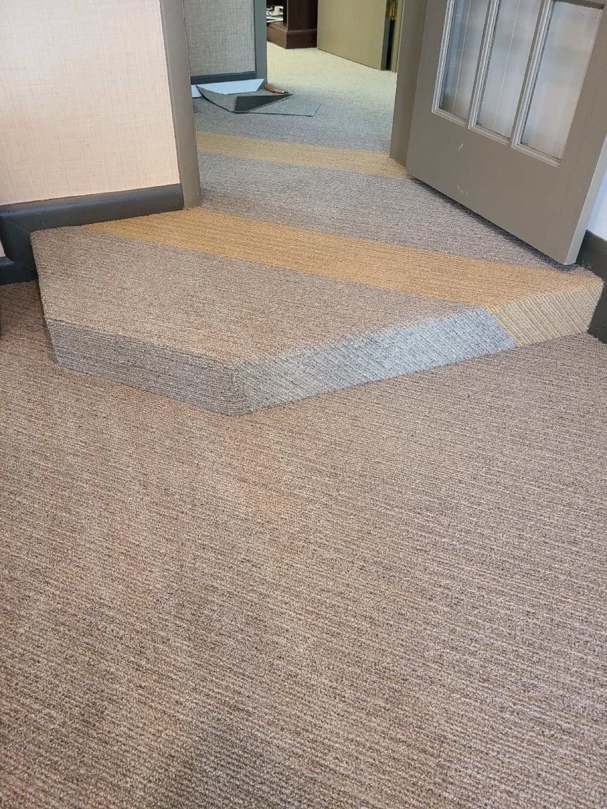 Geometric pattern commercial carpet tile installation — installed by Threshing Floors