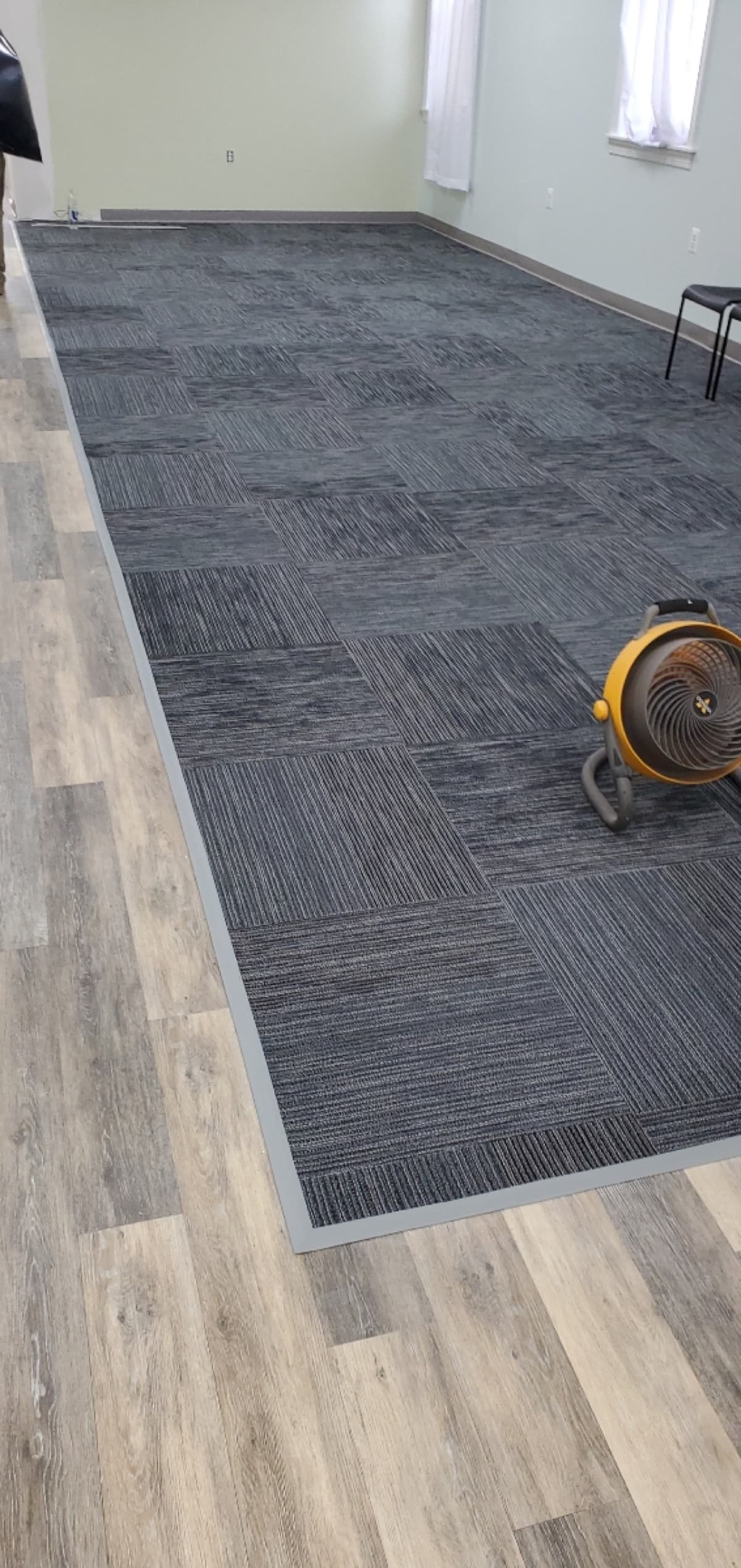 Commercial carpet tile alongside LVP in an office space — installed by Threshing Floors