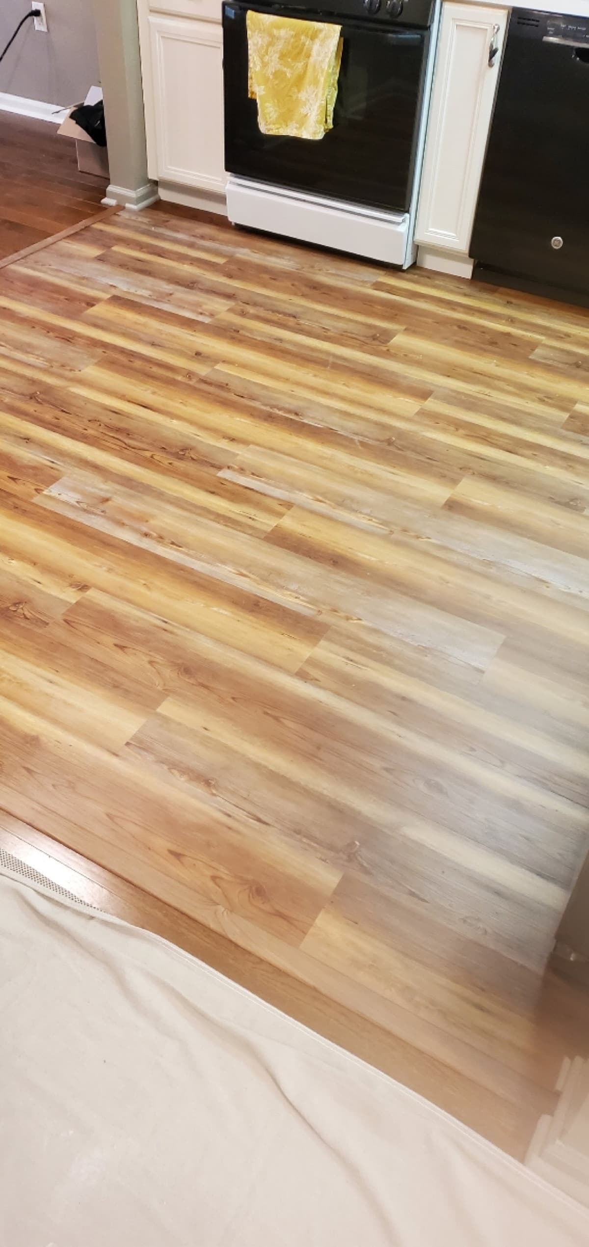 Wood-look LVP flooring in a residential kitchen — installed by Threshing Floors